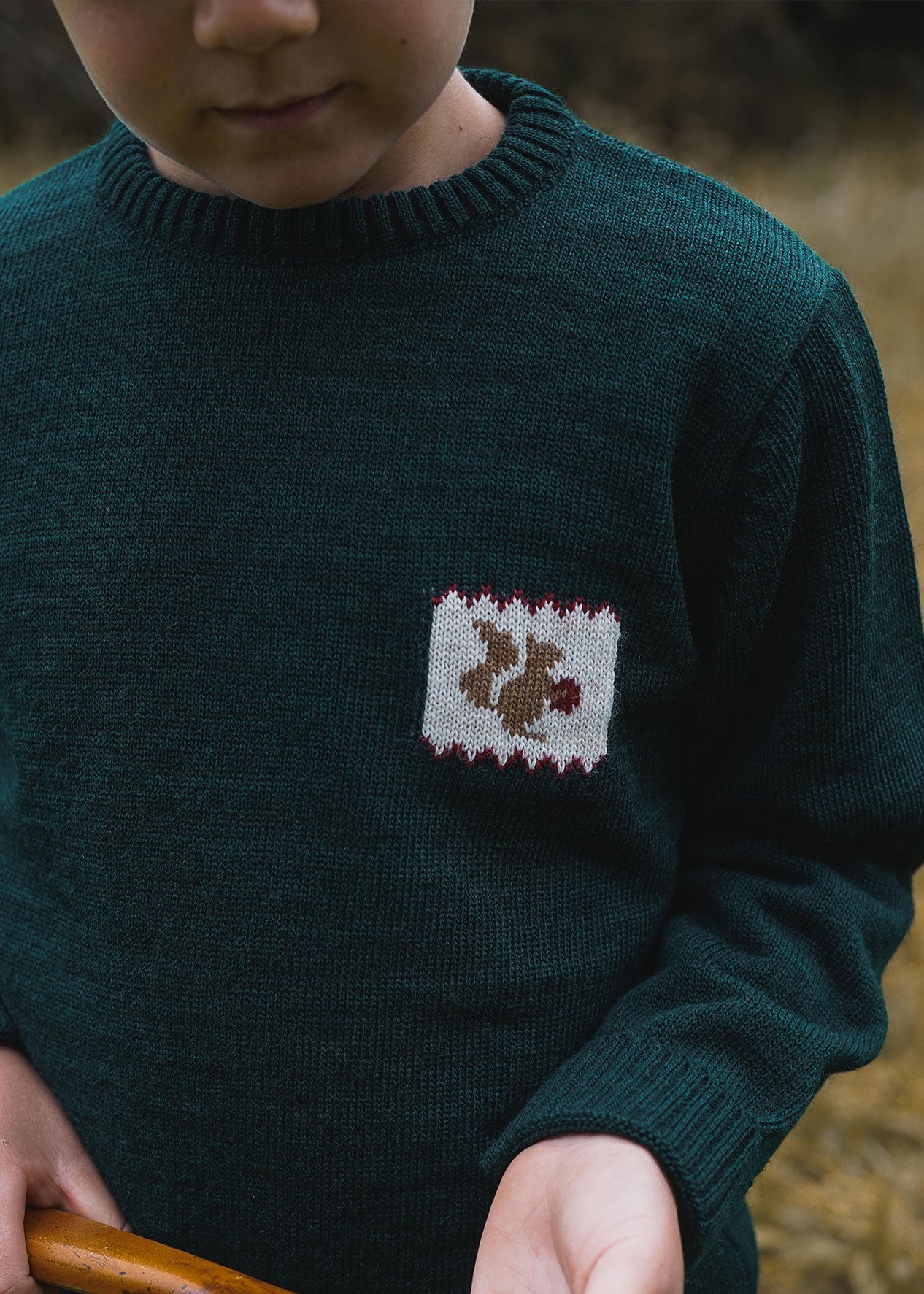 Navy blue sweater with light blue fret